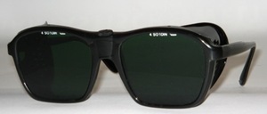 Screwed black goggles with side cups and greenish gray DIN glasses