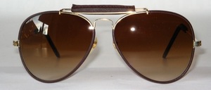 A very nice pilot sunglasses covered with brown leather, also the temple ends are made of leather