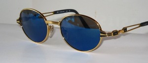 High quality, very beautiful oval sunglasses, made in Italy in golden metal with blue mirrored CR 39 lenses with 100% UV protection