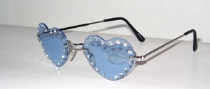 Rimless 4 - hole ladies sunglasses in silver, with heart - shaped bright blue discs and big rhinestones around them