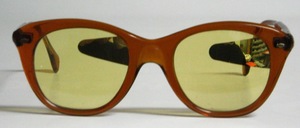 A funny night driving glasses with yellow mineral glass which is mirrored on the left side on each glass to darken the light of oncoming traffic