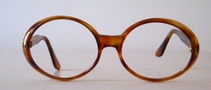 A slightly larger, oval acetate frame from the 1980s