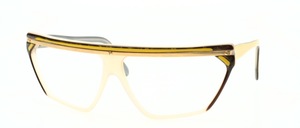 A fancy, hand-crafted acetate frame in a sleek design with a narrow top metal bar