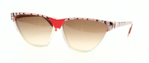 Big Vintage Cat Eye Glasses from the 80s in transparent with red and silver placed at the top of the rim and on the temples