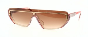 A handmade acetate frame with gold metal decoration