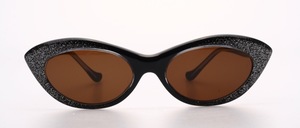 A very nice, handmade acetate sunglasses in the 50s butterfly style in black with silvery, fine glitter