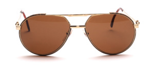 A slightly larger pilot sunglasses in gold with brown glass rim from Kappa