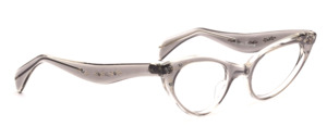 Classic cat eye frame in transparent gray with decor and silver decorative rivets and beautifully curved temples
