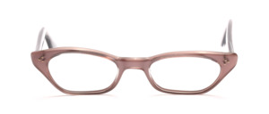 Sixties ladies' glasses in a hinted cat eye shape in light brown with silvery inside with decorative rivets on the middle part