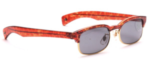 Combi sunglasses with gold rim and brown top and ironing