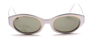 Women's sunglasses in white with gold trim around the glass and a fine black line around the edge