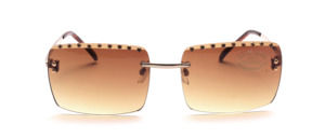 Rimless sunglasses in gold with rhinestone trim on the upper edge of the glass