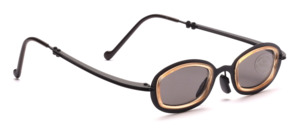 Small black metal sunglasses with beige plastic inlays and slightly flared temples