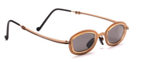 Small gold metal sunglasses with beige plastic inlays and slightly flared temples