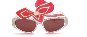 A striking pair of glasses made by artist hand, with a large bow, set with pearls in the middle