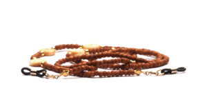 Glasses chain made of brown balsa wood beads with bright round horn pieces and golden pearls