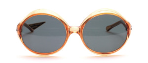 Large, oval vintage sunglasses made of acetate in transparent brown with gray mineral lenses