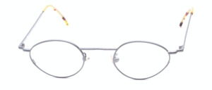 Small, oval metal eyeglasses with wider sides in matte grey