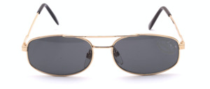 Flat pilot sunglasses in gold with grey lenses by Tropical