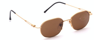 Metal sunglasses in gold with brown lenses and slightly flared temples