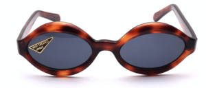 Oval acetate sunglasses in demi amber with grey mineral glass lenses