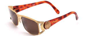 A high quality, creatively crafted metal sunglass with wider havanna brown acetate straps with gold trim