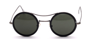Elegant round metal Sunglasses in antique Silver color with a black cellrim and double bridge, made in Italy
