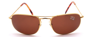 High-quality, very noble slightly curved metal sunglasses in gold with brown lenses