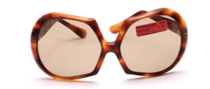 Of the hand of the french design icon Paulette Guinet is this vintage treasure from the 1970s in brown havanna, half round, half square shape