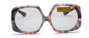 Of the hand of the french design icon Paulette Guinet is this vintage treasure from the late 1960s in grey-brrown mix, half round, half square shape