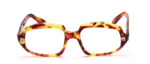 Vintage Pierre Cardin acetate frame in light brown- yellow patterned material with silver logo on the front