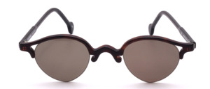 Round semi-rimless sunglasses in dark brown acetate with black temples; elegant 90s vintage-style design without nose pads; grey lenses; made in Germany