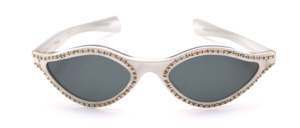 Original vintage 1950s 'cat-eye butterfly' sunglasses made of crystal acetate with a white finish and elegant rhinestone detailing along the lens rims and temple hinges