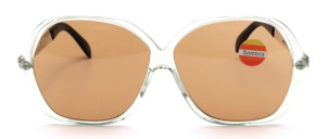 Oversized vintage sunglasses from the 1960s, made of transparent light-green acetate with silver temples and brown mineral lenses