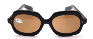 Stylish 1960s vintage sunglasses made of black acetate with brown mineral lenses